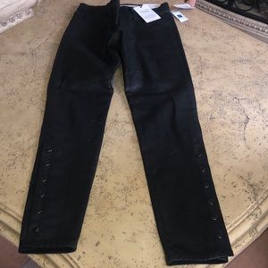 Black textured jeans with buttons down the side